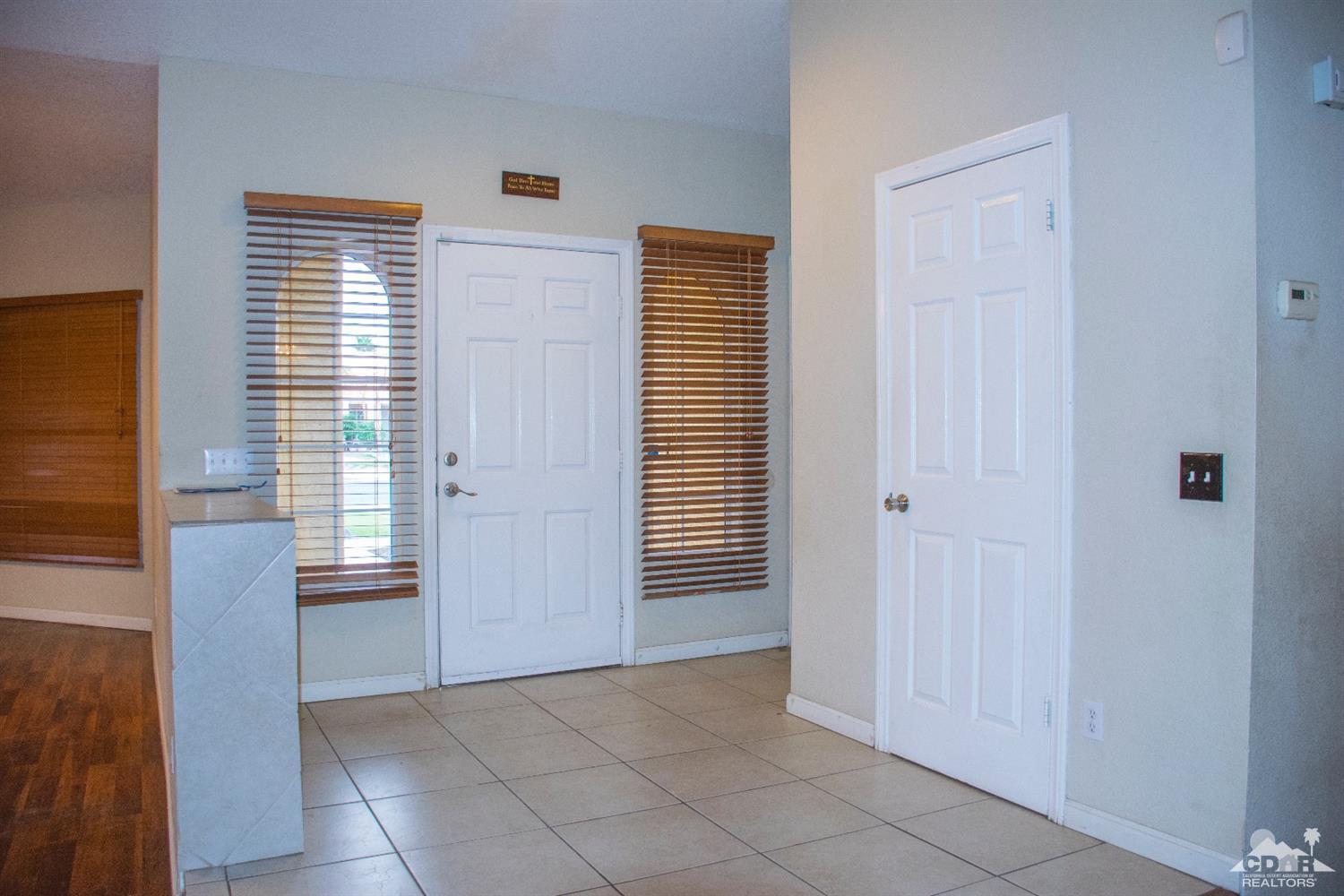 68340 Tortuga Road Cathedral City, CA 92234 - Photo 8 of 37 an empty room with windows