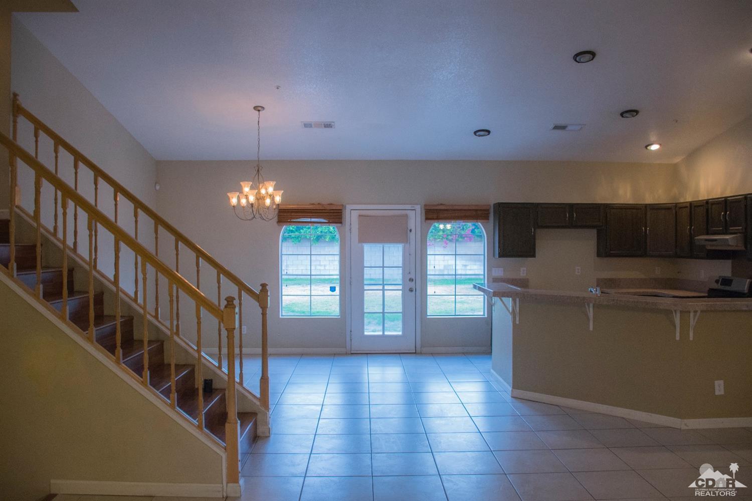 68340 Tortuga Road Cathedral City, CA 92234 - Photo 9 of 37 a view of a kitchen with furniture and staircase