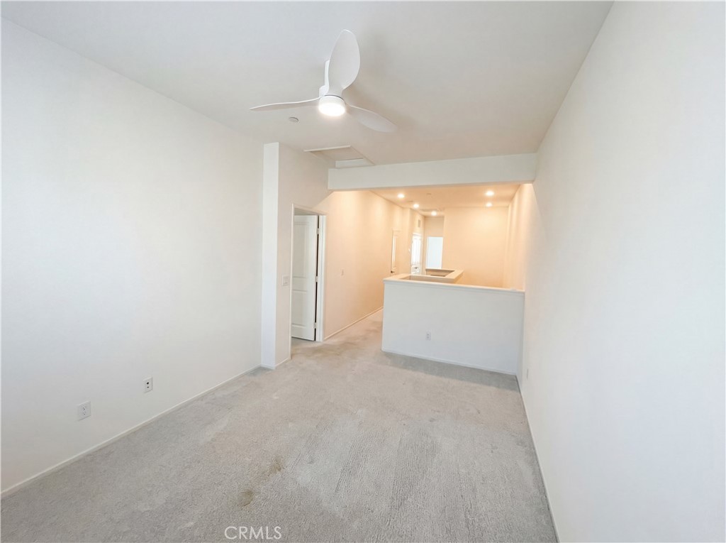5628 Kate Way, Unit 3 Fontana, CA 92336 - Photo 14 of 20 a view of an empty room and a window