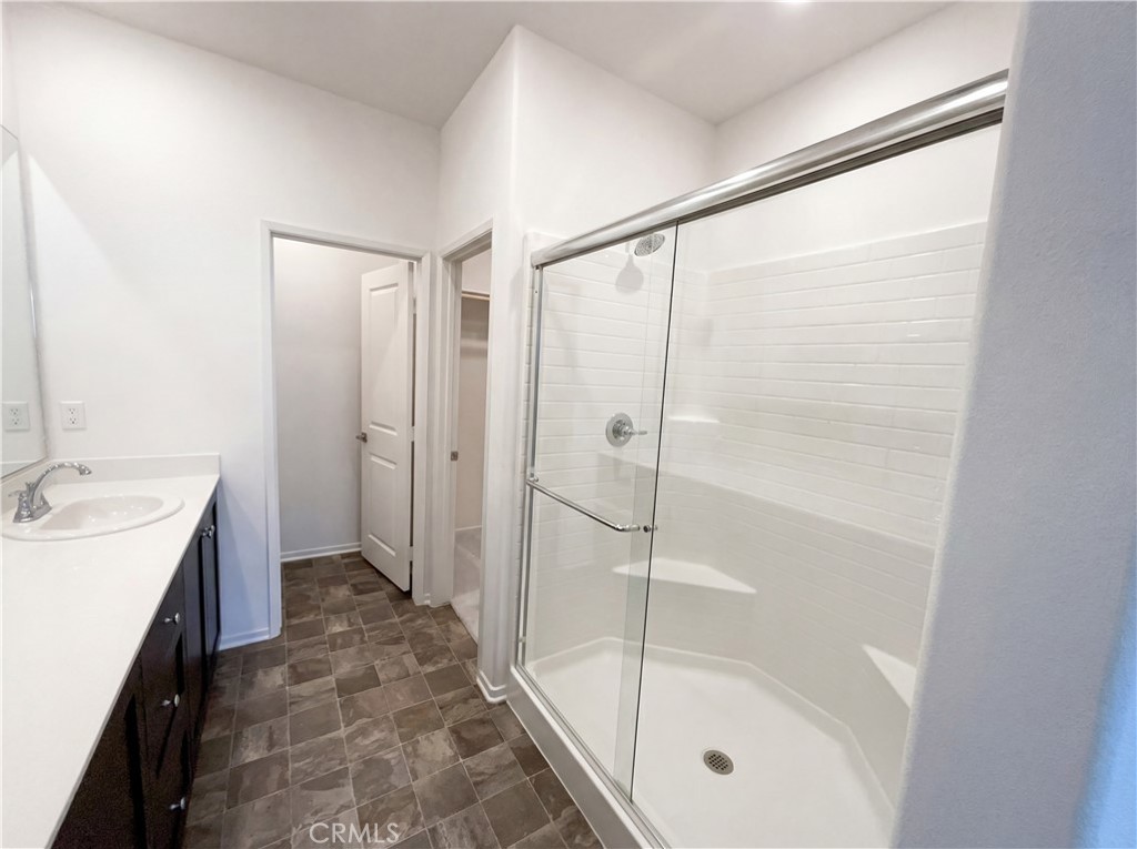 5628 Kate Way, Unit 3 Fontana, CA 92336 - Photo 17 of 20 a bathroom with a shower and a sink