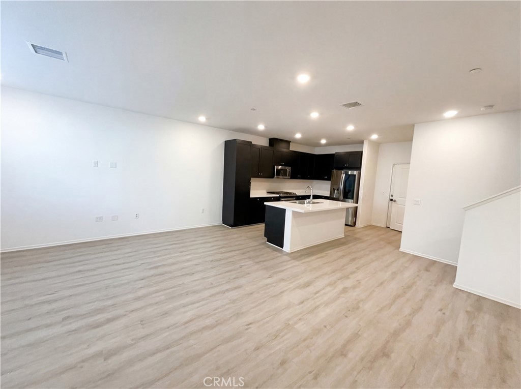 5628 Kate Way, Unit 3 Fontana, CA 92336 - Photo 3 of 20 a view of kitchen with wooden floor