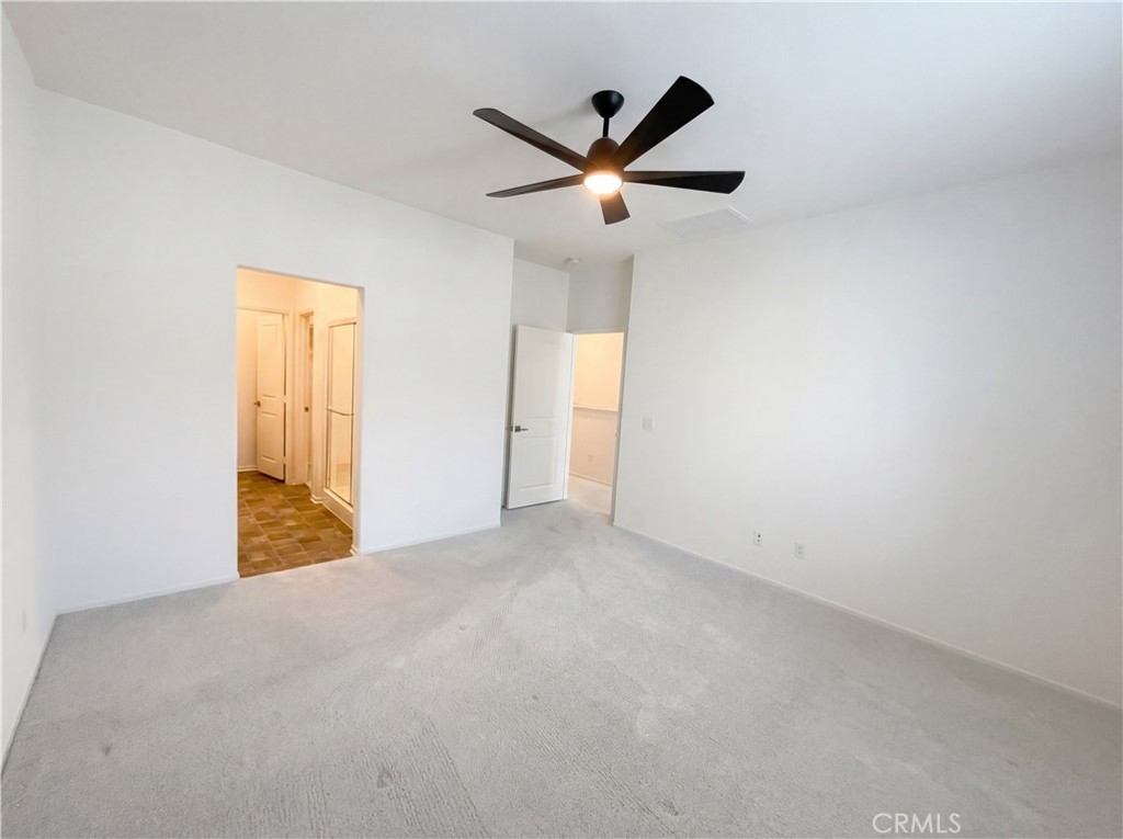 5628 Kate Way, Unit 3 Fontana, CA 92336 - Photo 4 of 20 a view of a livingroom with a ceiling fan and window