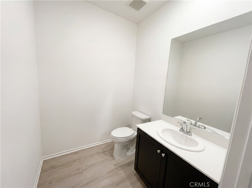 5628 Kate Way, Unit 3 Fontana, CA 92336 - Photo 9 of 20 a bathroom with a sink and a toilet