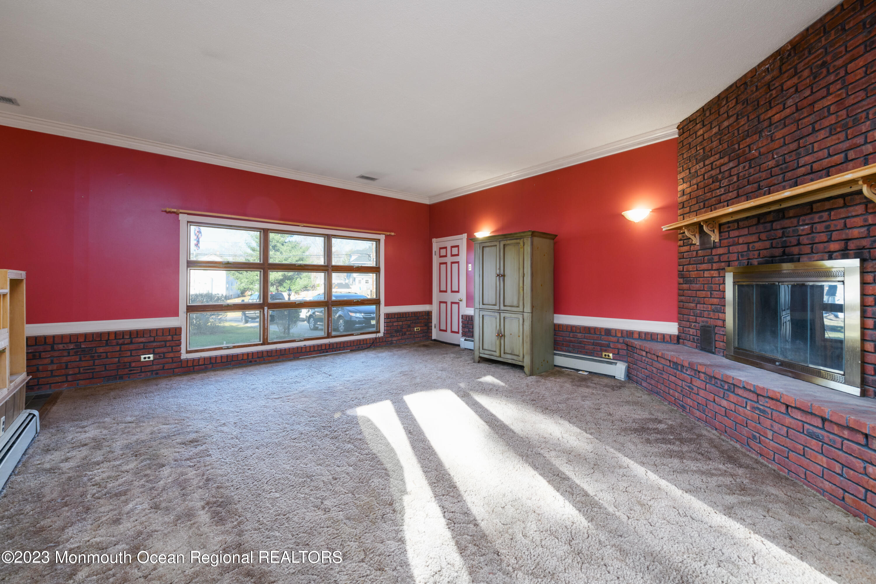 13 Texas Road Matawan, NJ 07747 - Photo 14 of 33 a view of an empty room with a fireplace and a window