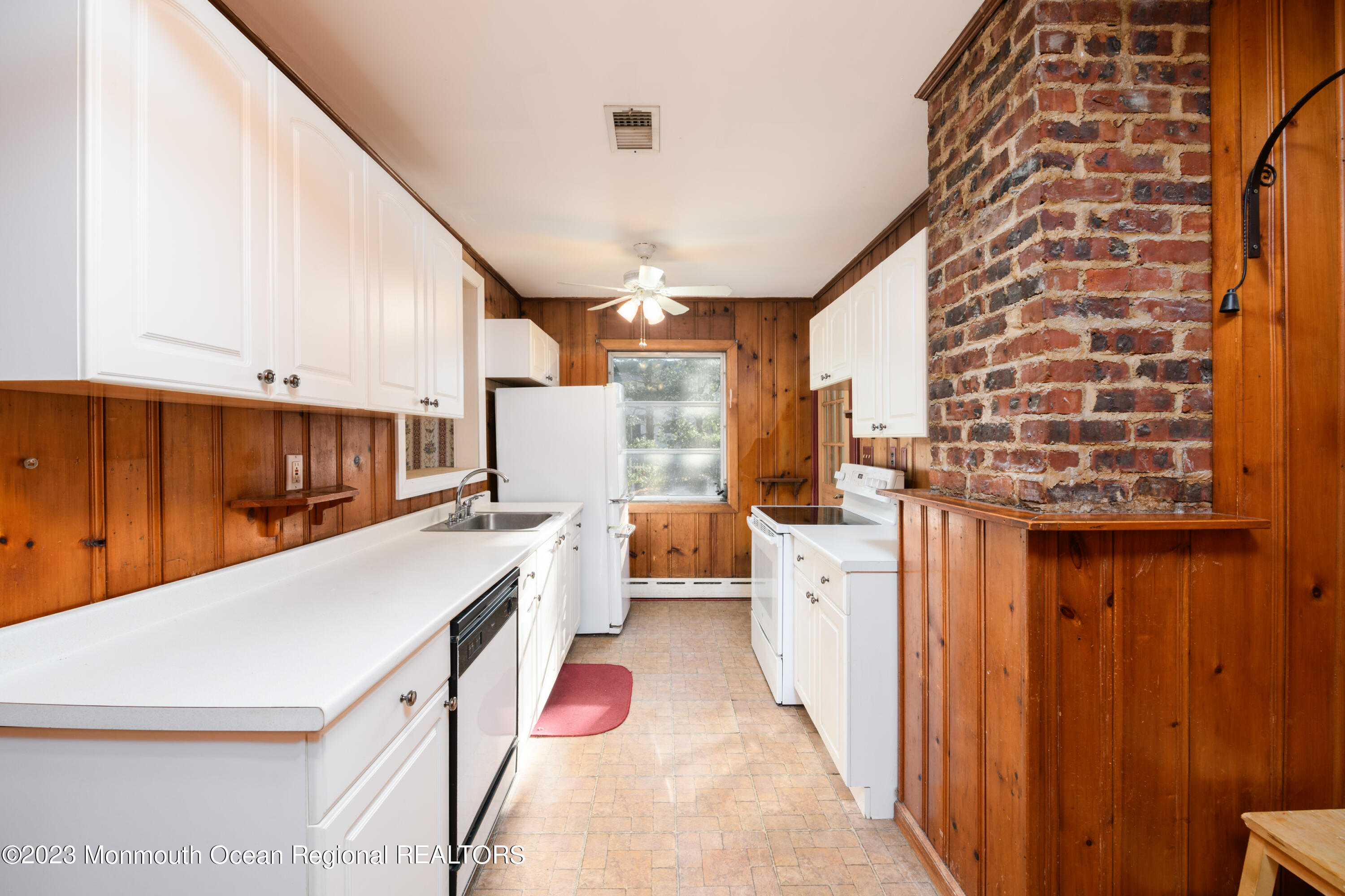13 Texas Road Matawan, NJ 07747 - Photo 22 of 33 a kitchen with a stove a sink and a refrigerator