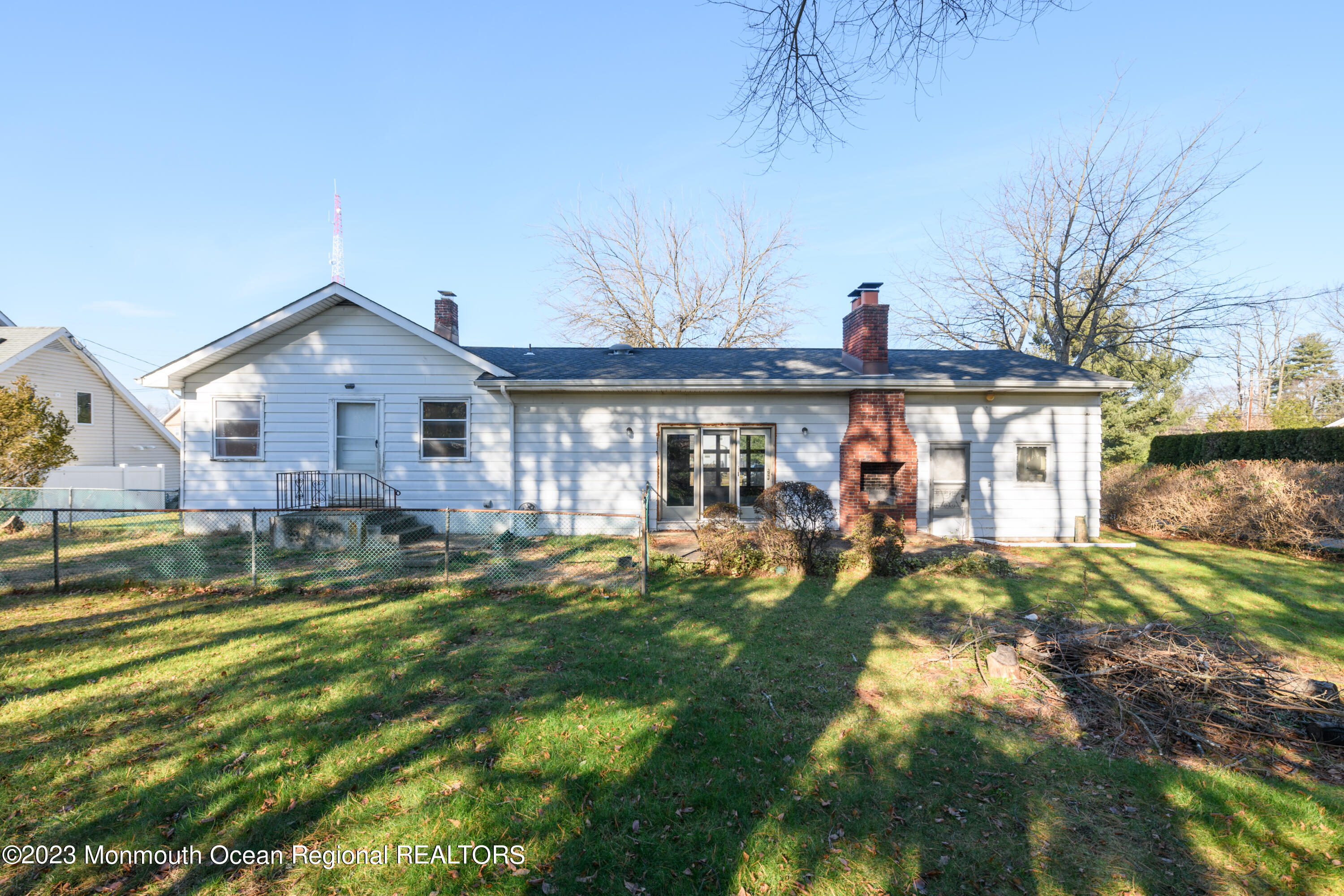 13 Texas Road Matawan, NJ 07747 - Photo 6 of 33 a front view of a house with a yard table and chairs