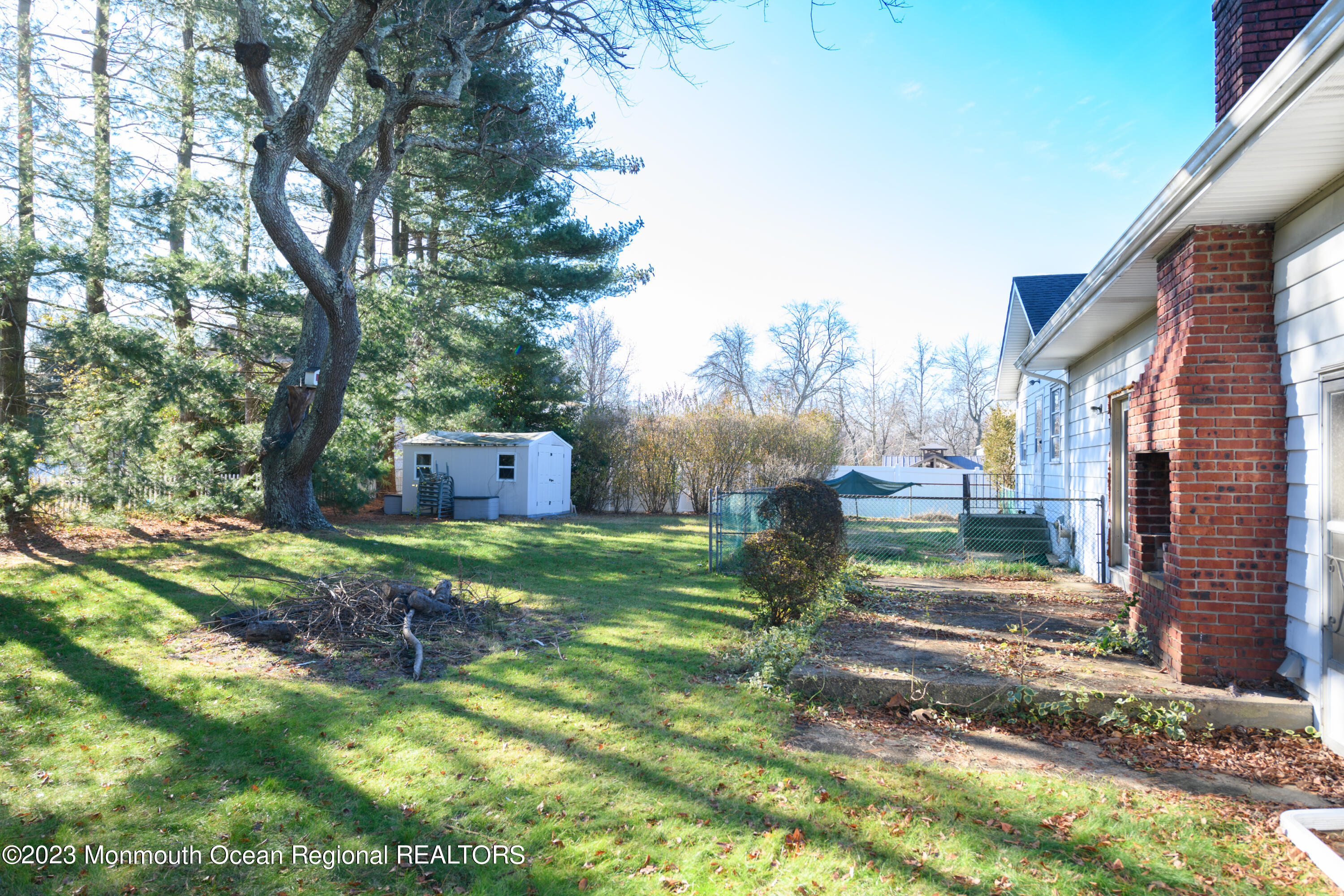 13 Texas Road Matawan, NJ 07747 - Photo 10 of 33 a backyard of a house with table and chairs