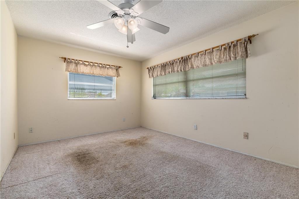 1523 Northwest Spruce Ridge Drive Stuart, FL 34994 - Photo 14 of 16 a view of an empty room with a window
