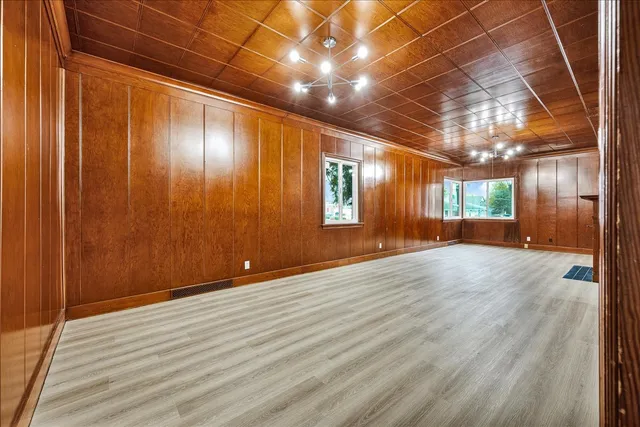 a view of hallway with wooden floor