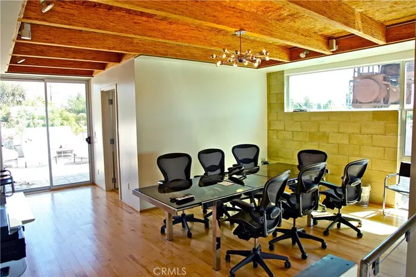 a view of a chairs and table in a patio