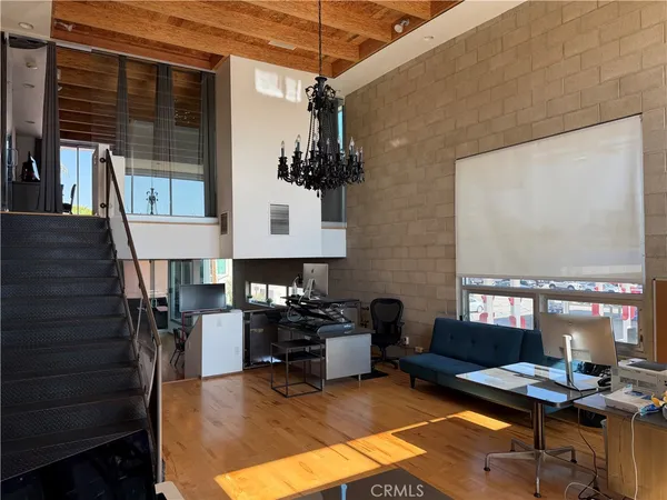 a work place with furniture lamp and window