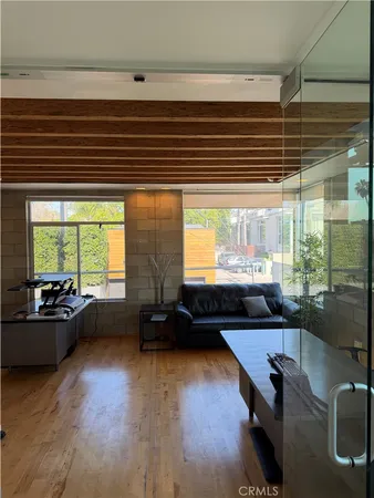 a livingroom with furniture and wooden floor