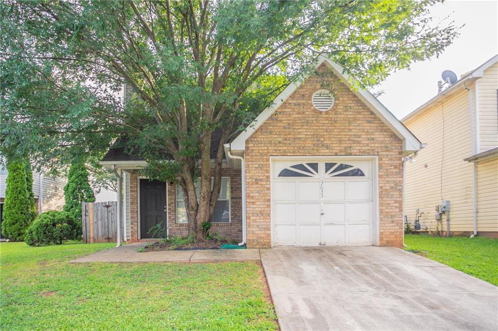 3633 Emerald Point Decatur, GA 30034 - Photo 1 of 1 front view of a house with a yard and an trees