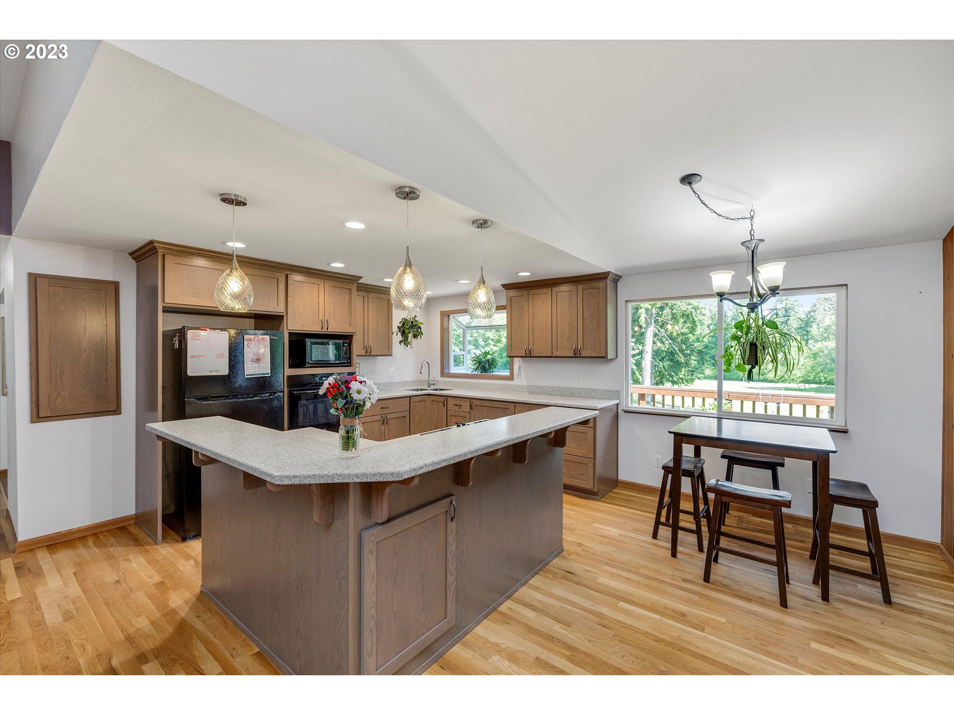 74783 Doan Road Rainier, OR 97048 - Photo 8 of 48 a kitchen with stainless steel appliances granite countertop a sink a stove and a wooden floors