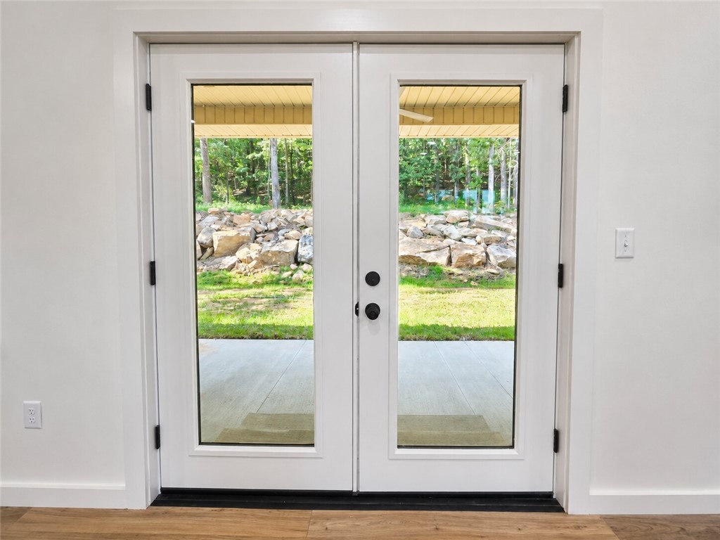 331 Channel Circle Russellville, AR 72802 - Photo 27 of 29 Dual French doors with full-length glass panels open to an outdoor patio