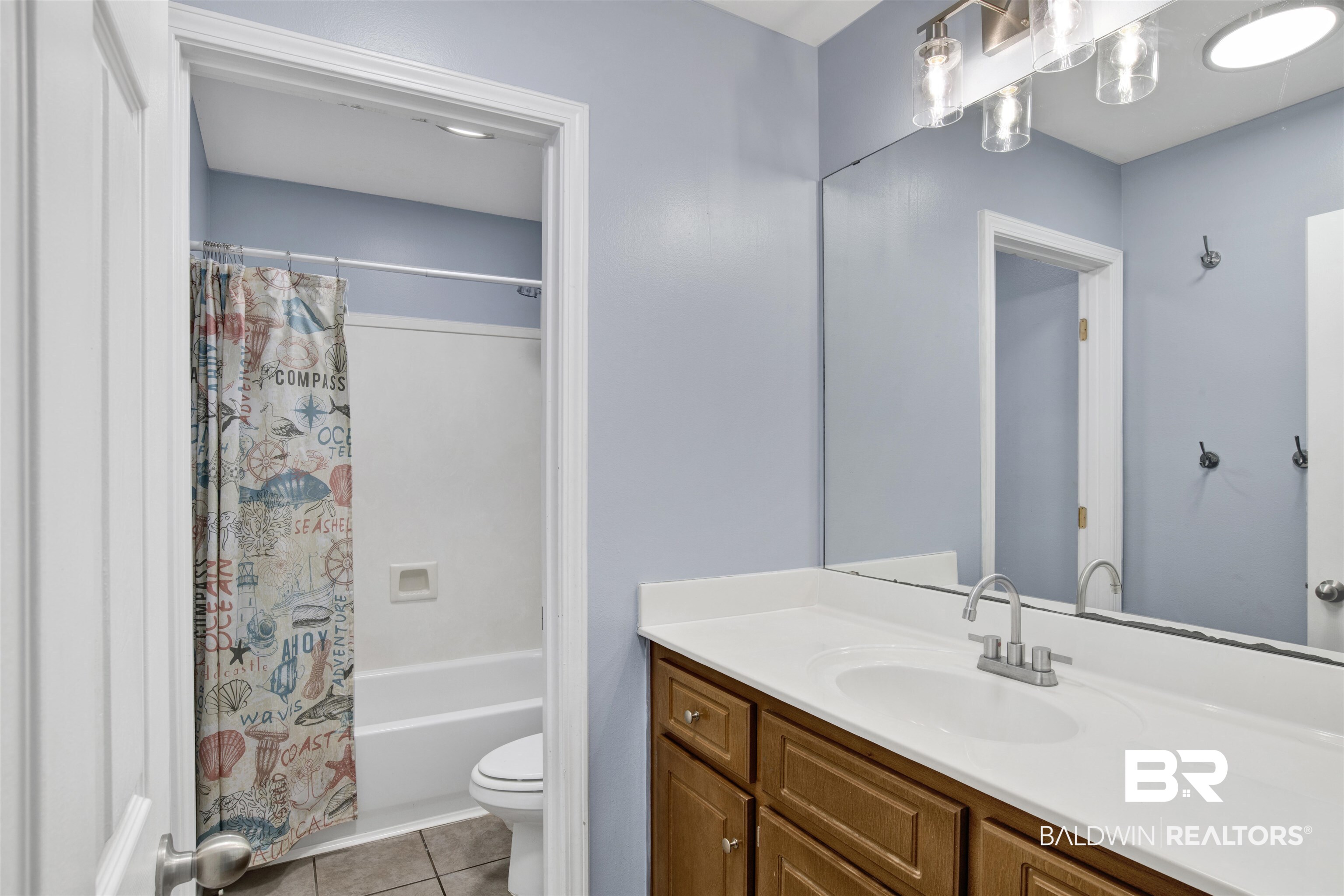 9534 Labrador Run North Mobile, AL 36695 - Photo 18 of 30 Bathroom with light tile patterned flooring, vanity, and shower / bath combo