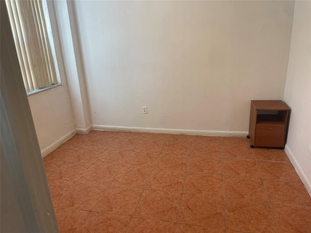 36 Southwest 14th Street, Unit 2 Dania Beach, FL 33004 - Photo 5 of 6 a view of an empty room