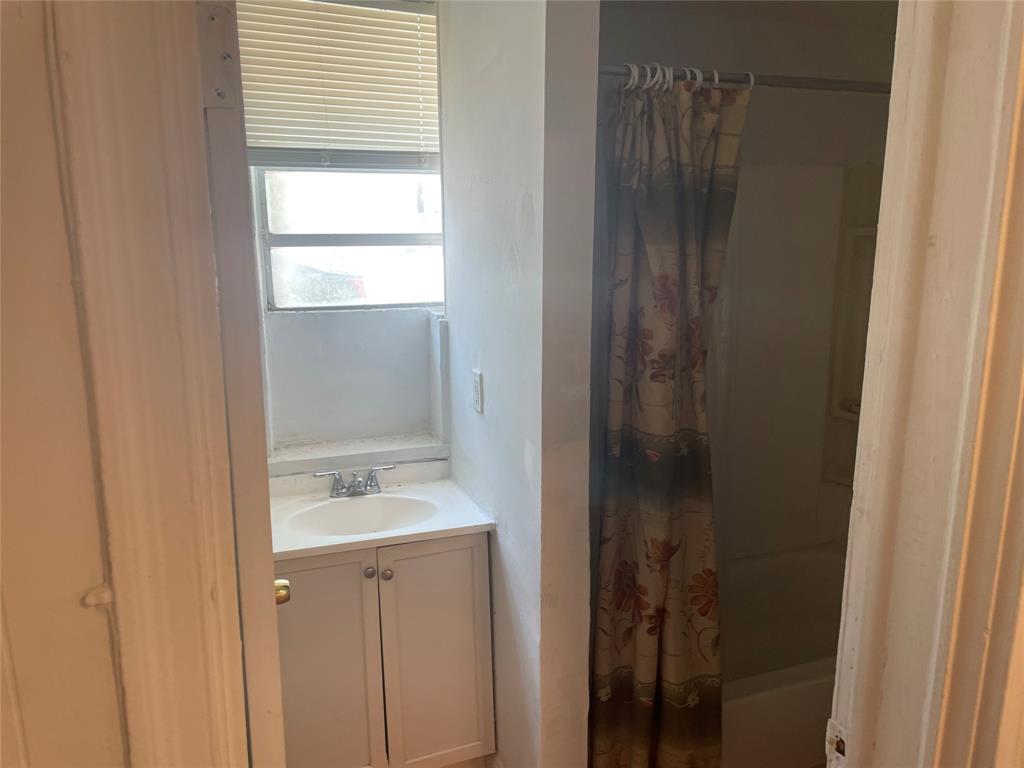 36 Southwest 14th Street, Unit 2 Dania Beach, FL 33004 - Photo 6 of 6 a bathroom with a shower and a sink