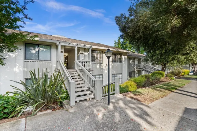 a front view of a house with garden