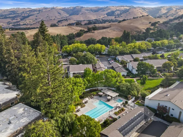 an aerial view of a house with a lake view