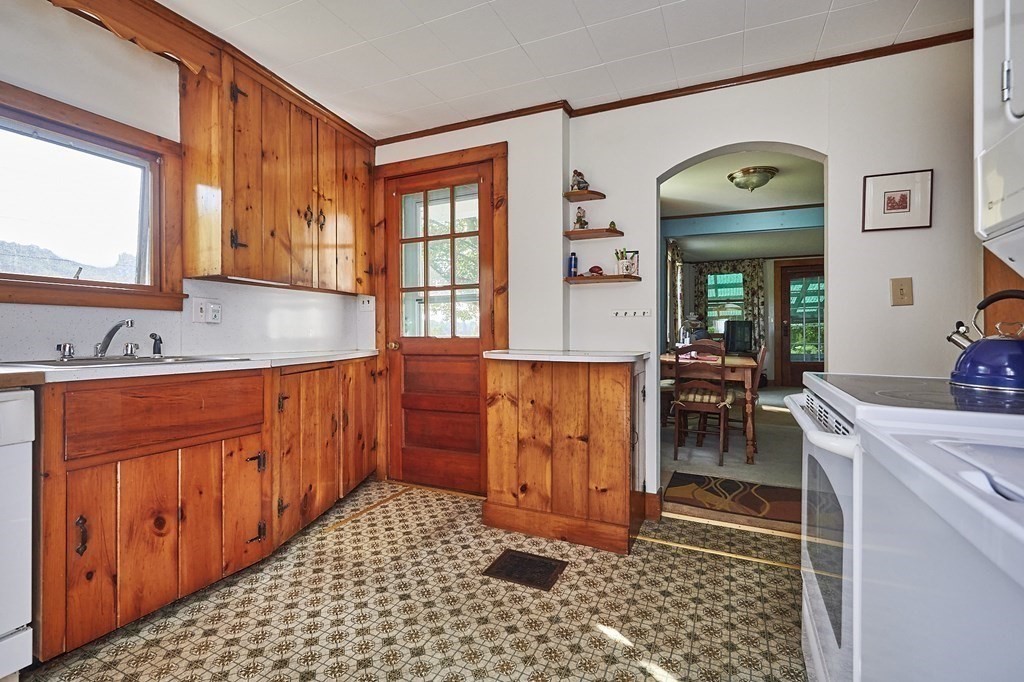 171 Barnes Road Ashfield, MA 01370 - Photo 8 of 26 a hallway with a sink and cabinets