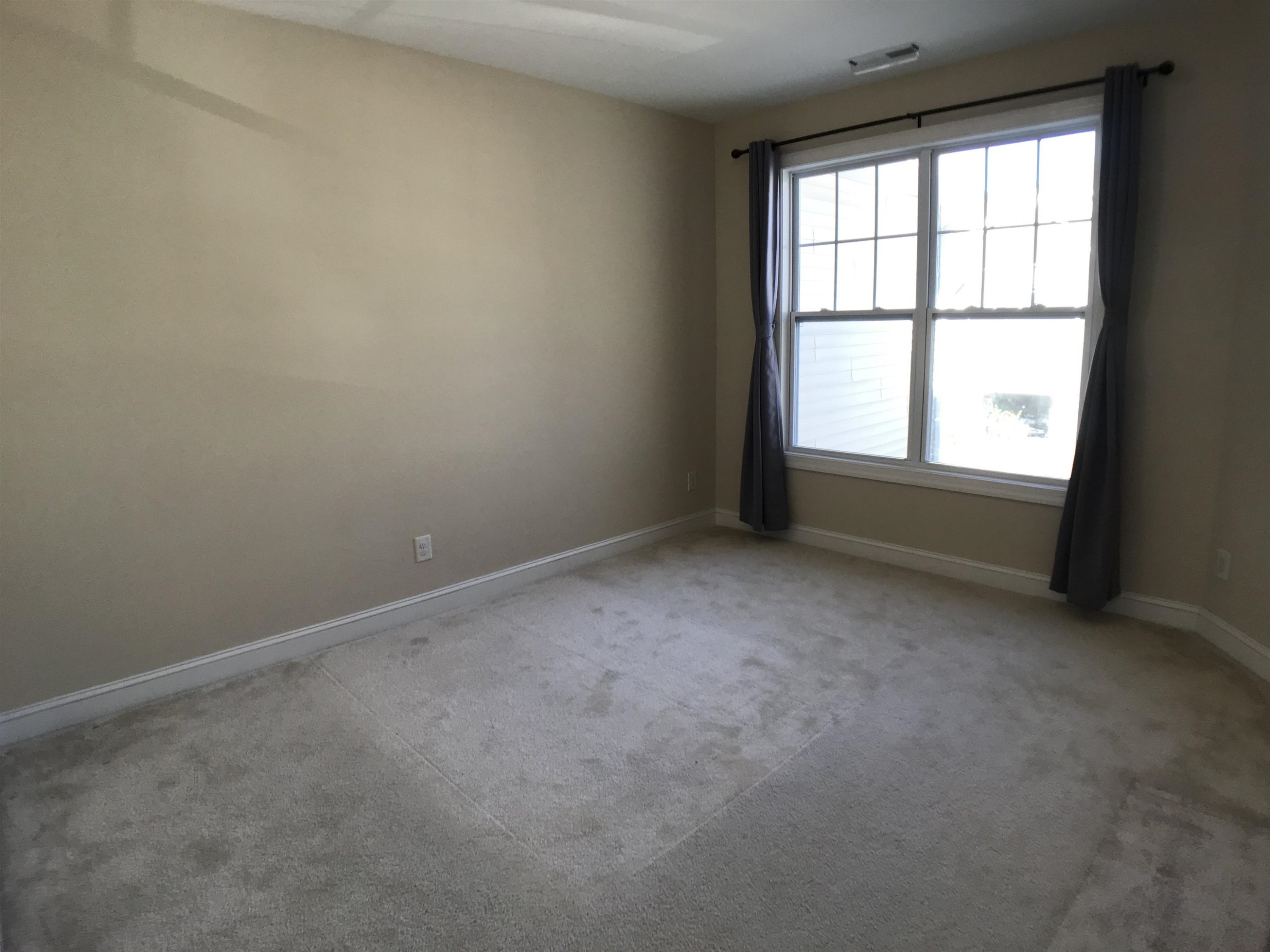 925 Rosepine Drive Cary, NC 27519 - Photo 16 of 21 an empty room with a window