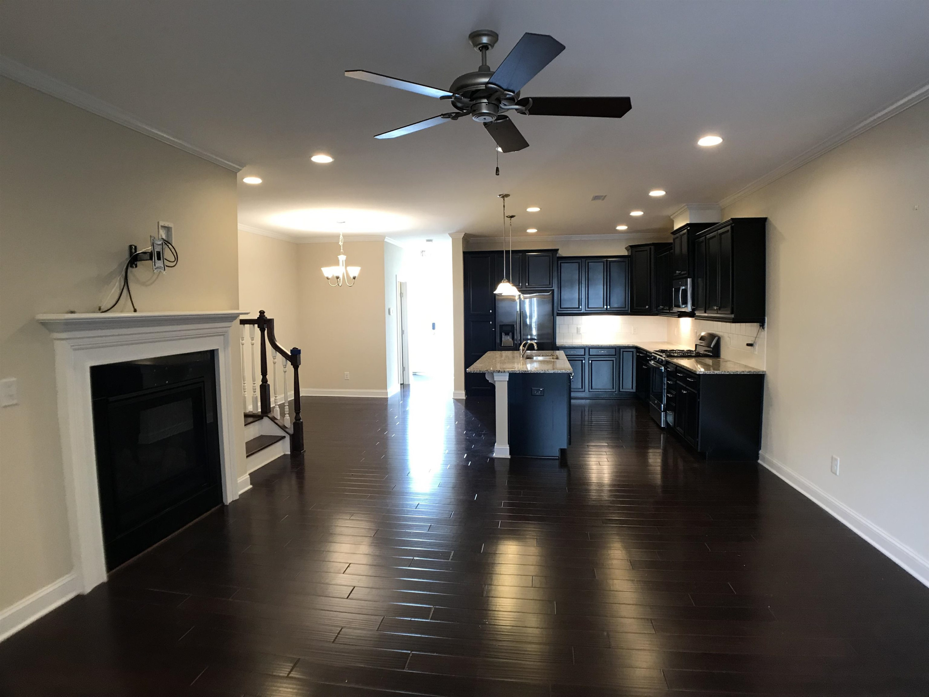 925 Rosepine Drive Cary, NC 27519 - Photo 5 of 21 a view of a kitchen with a sink and a fireplace