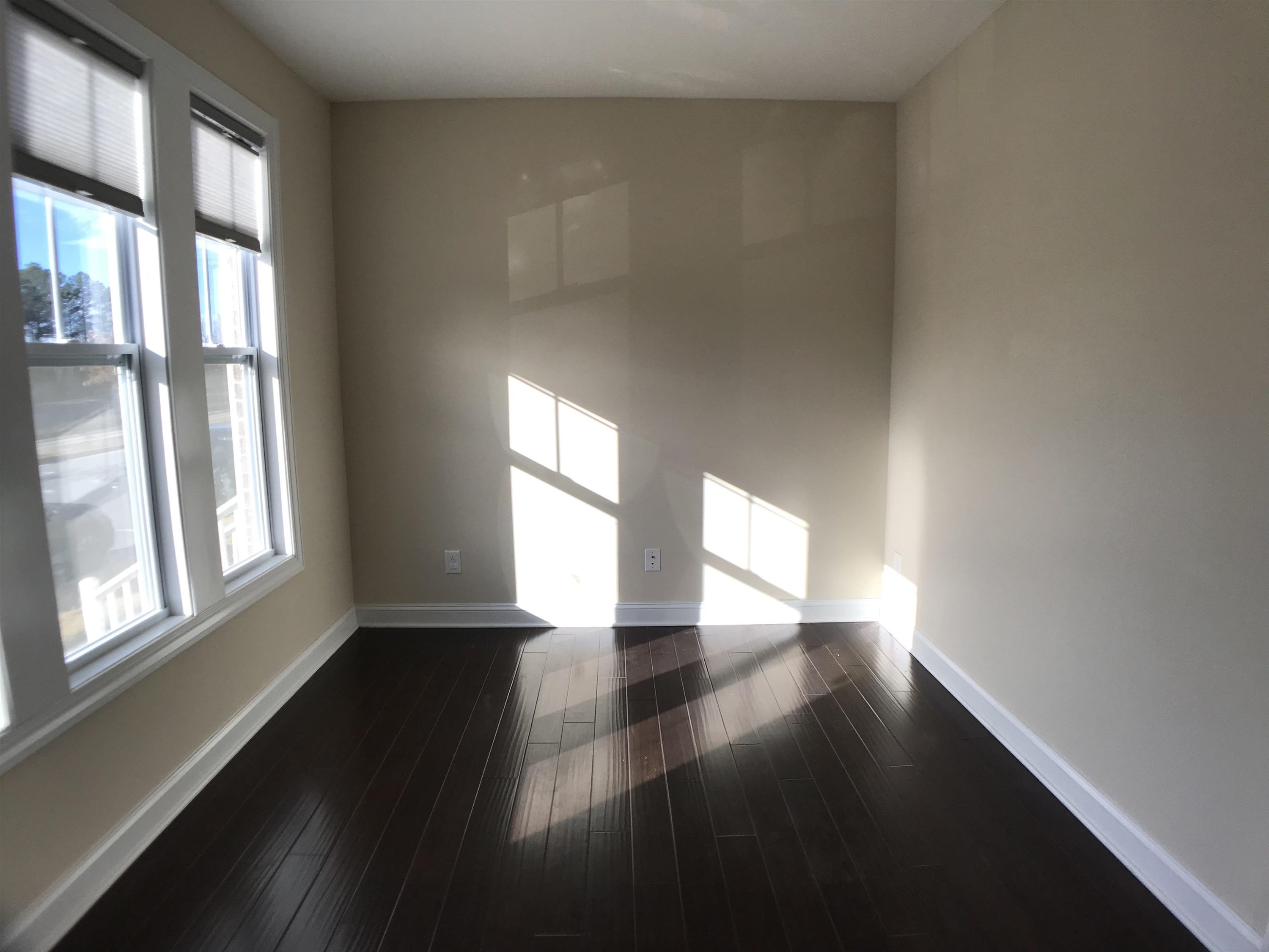 925 Rosepine Drive Cary, NC 27519 - Photo 7 of 21 wooden floor in an empty room with a window