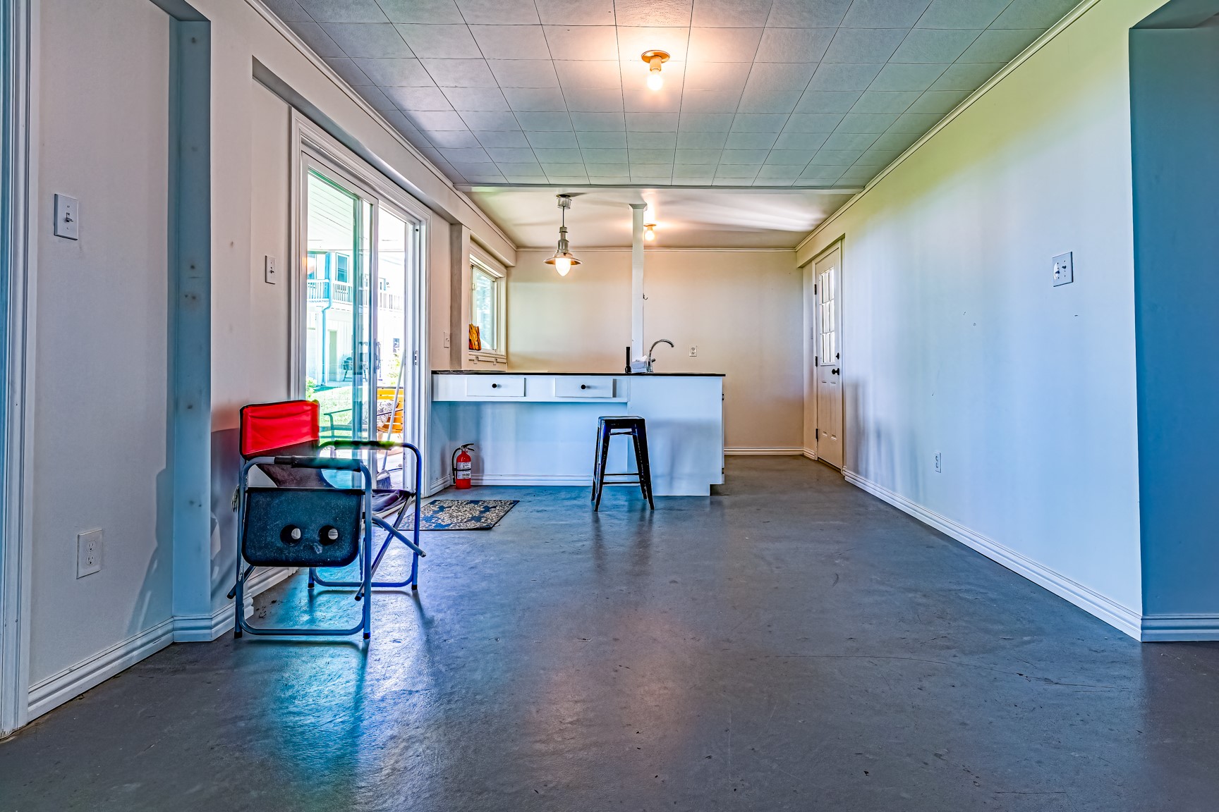 480 Johnson Road Coldspring, TX 77331 - Photo 46 of 49 The main room downstairs is 37x11 and opens out to the patio, backyard and lake. The possibilities are endless...