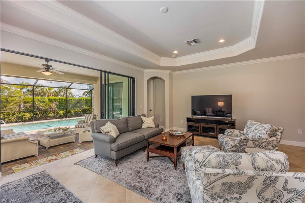 9422 Piacere Way Naples, FL 34113 - Photo 3 of 25 Great room with indoor / outdoor living