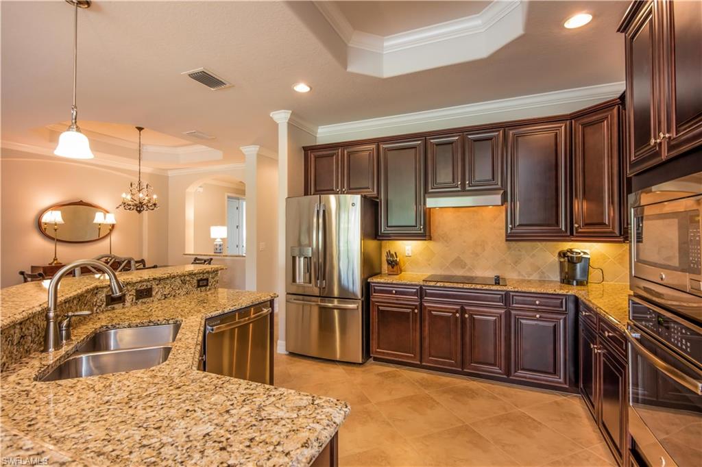 9422 Piacere Way Naples, FL 34113 - Photo 5 of 25 Spacious open kitchen with updated appliances