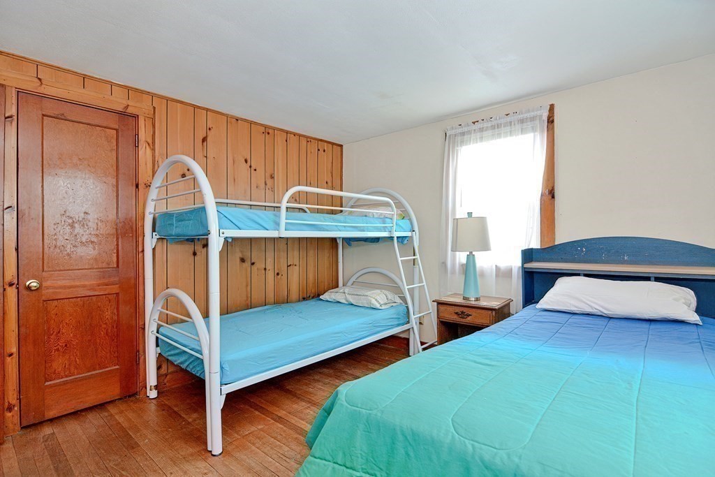 27 Naushon Road Dennis, MA 02639 - Photo 16 of 31 a bedroom with two beds and a window