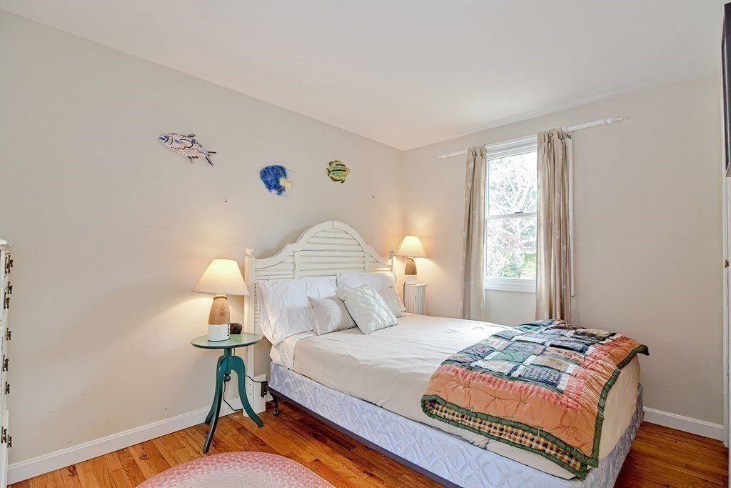 27 Naushon Road Dennis, MA 02639 - Photo 18 of 31 a bedroom with a bed and a window