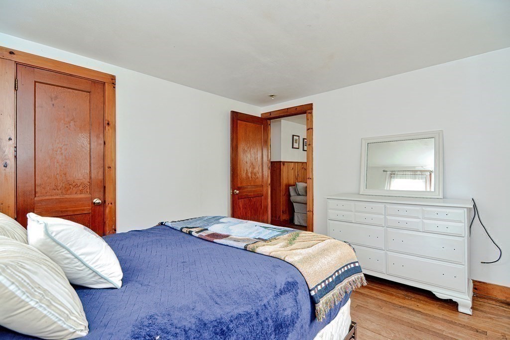 27 Naushon Road Dennis, MA 02639 - Photo 19 of 31 a bedroom with a bed and a closet