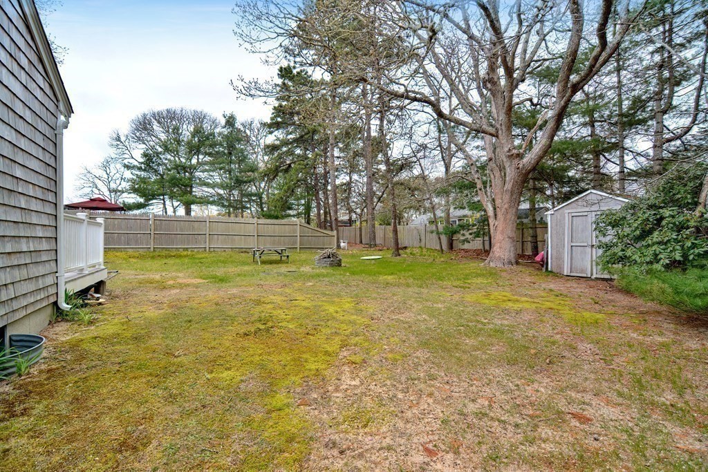 27 Naushon Road Dennis, MA 02639 - Photo 21 of 31 a view of a house with a yard