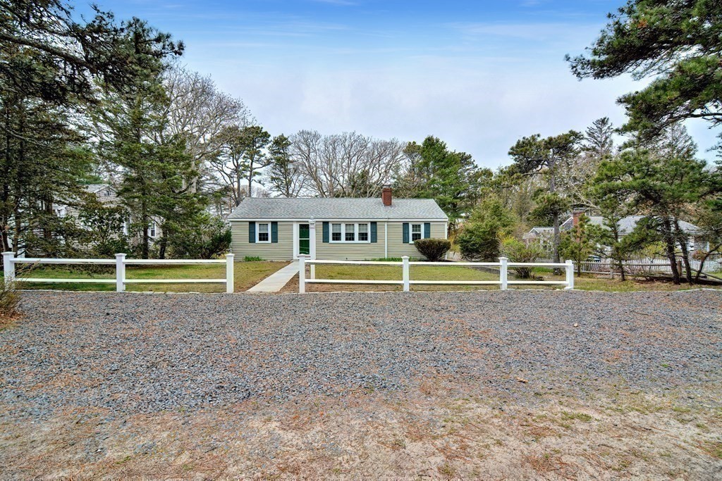 27 Naushon Road Dennis, MA 02639 - Photo 22 of 31 a view of a house with a yard