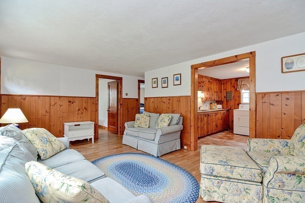 27 Naushon Road Dennis, MA 02639 - Photo 4 of 31 a bedroom with furniture and a couch