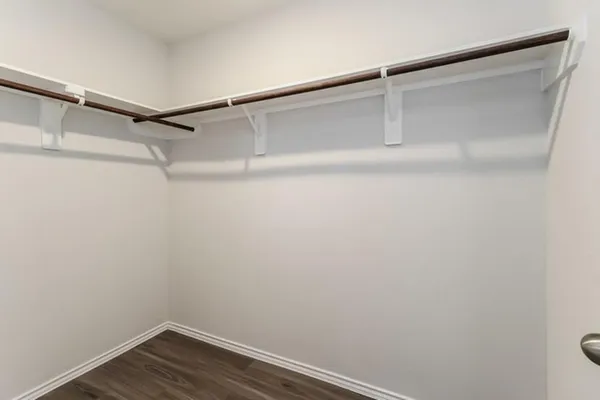 a view of an empty walk in closet