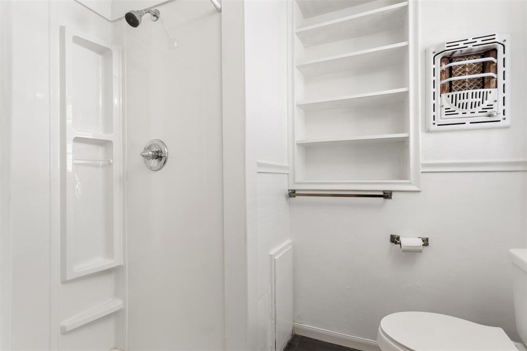 3126 Colgate Avenue Tyler, TX 75701 - Photo 21 of 33 a bathroom with a toilet and a shower