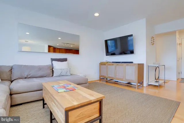a living room with a flat screen tv and a couch