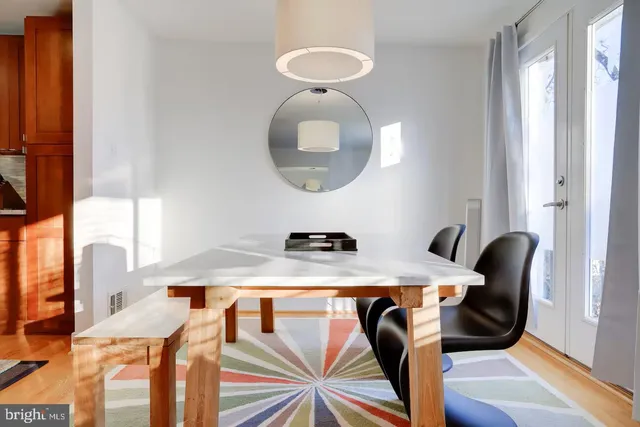 a view of a dining room with furniture and chandelier