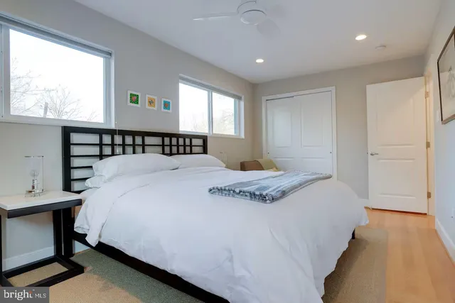 a bedroom with a bed and window