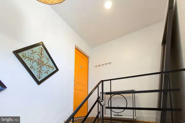 a view of staircase with a small stove