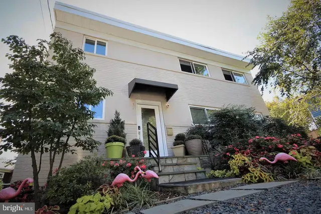 a front view of house with yard and outdoor seating
