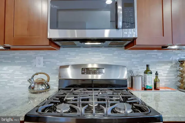 a kitchen with a stove and a microwave
