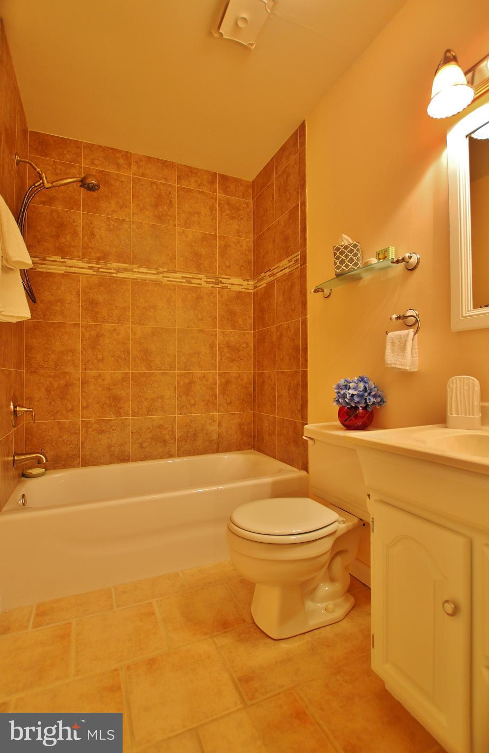 18049 Possum Point Road Dumfries, VA 22026 - Photo 15 of 30 a bathroom with a toilet and a shower