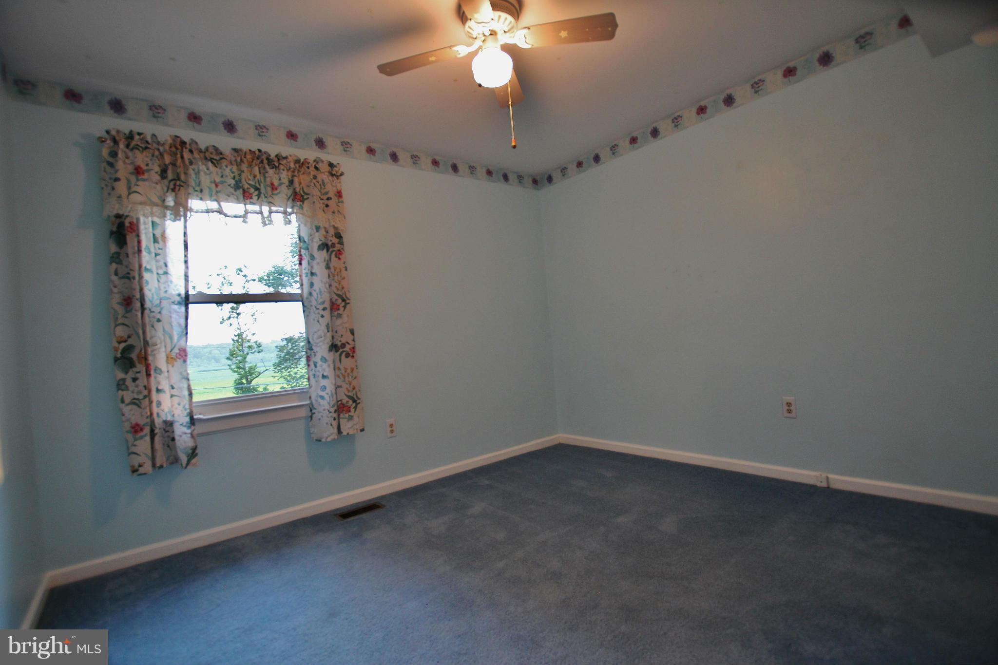 18049 Possum Point Road Dumfries, VA 22026 - Photo 16 of 30 en empty room with a window