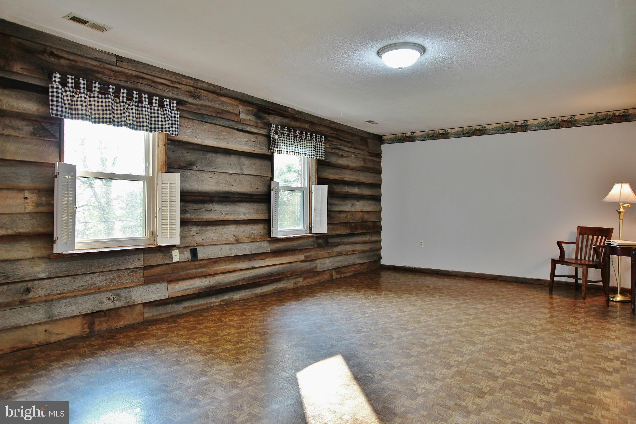 18049 Possum Point Road Dumfries, VA 22026 - Photo 19 of 30 a view of room with window and wooden floor