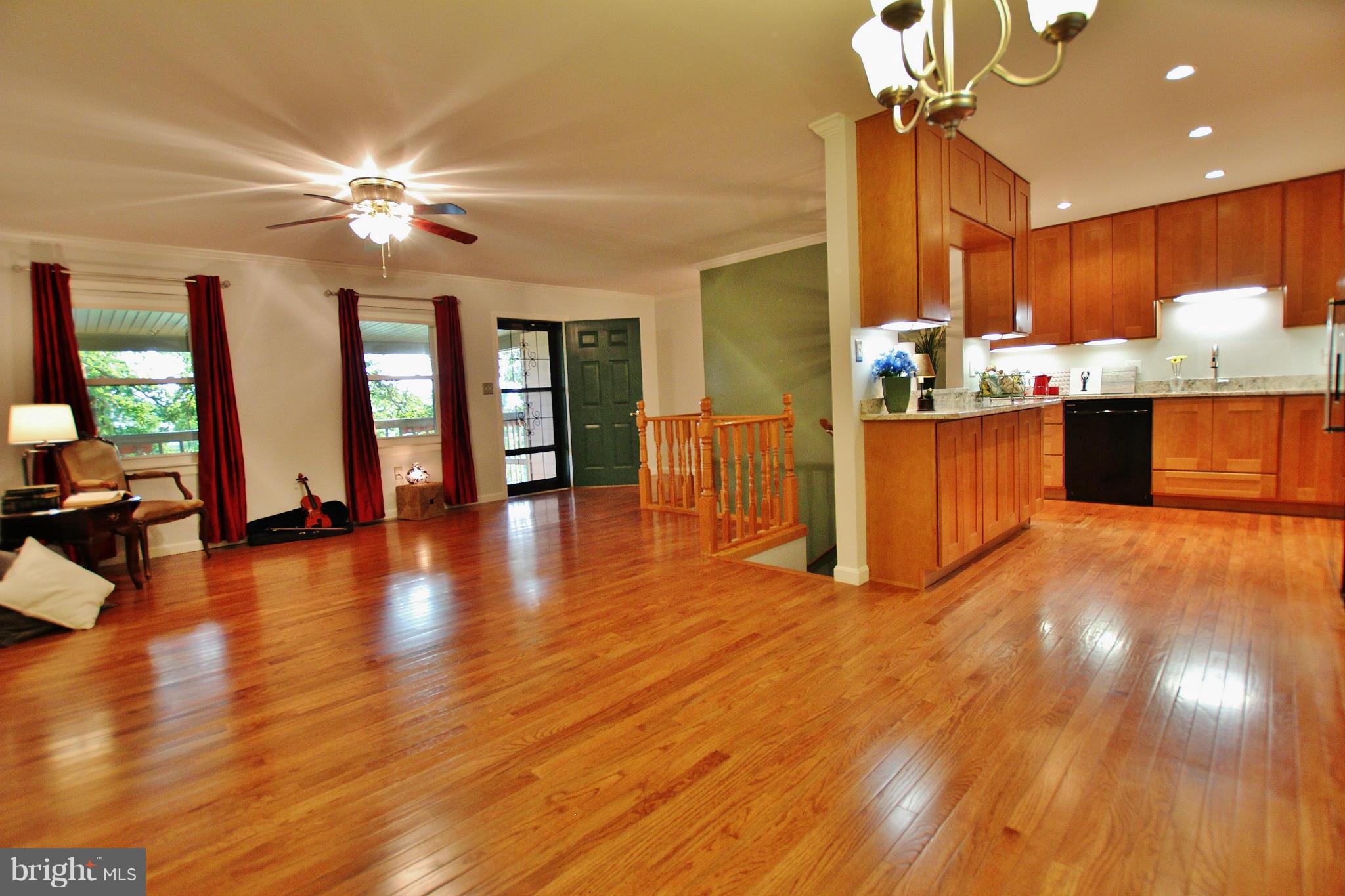 18049 Possum Point Road Dumfries, VA 22026 - Photo 5 of 30 a view of a kitchen with furniture and wooden floor