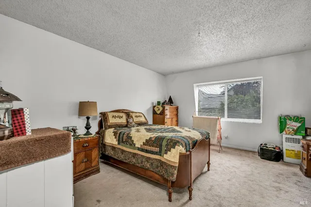 a bed room with a bed and a table